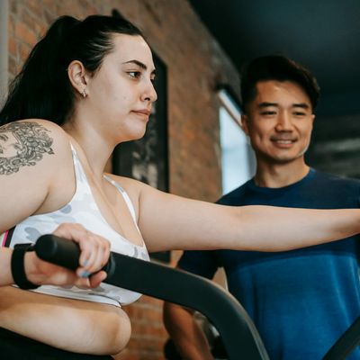 Blurred motion of a person transitioning between two exercise positions.