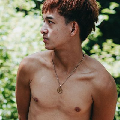 Profile view of a man's chest expanding as he takes a deep breath.